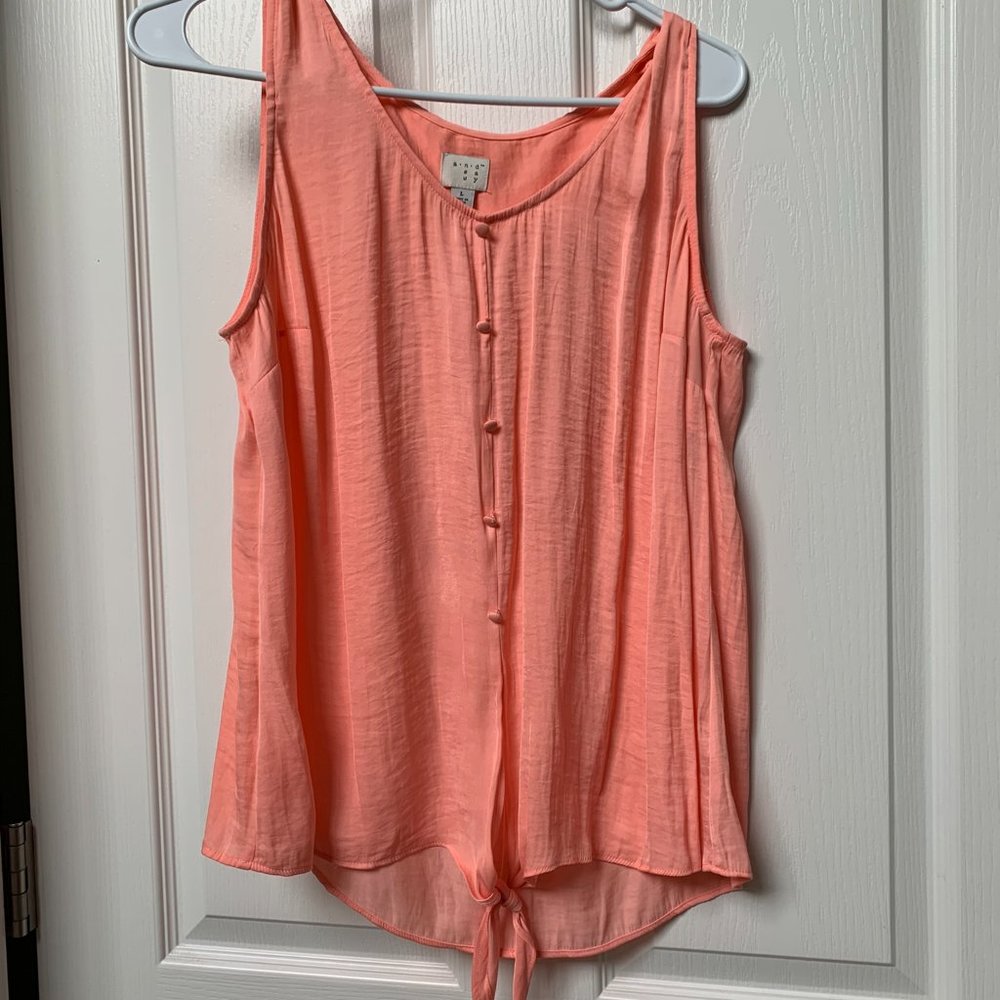 Large peach colored sleeveless top.